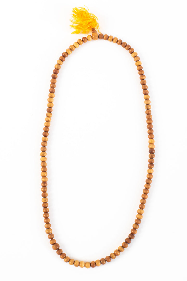 Sandalwood beaded mala on white background